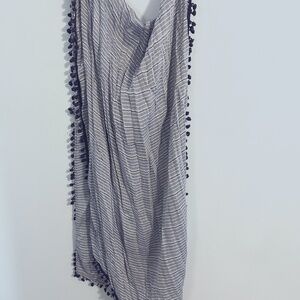Light blue scarf with pompom trim